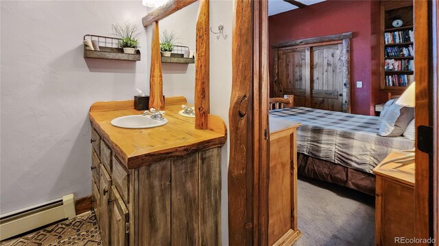 700 Cottage Grove Rd, Alma, CO 80420 - ensuite bathroom with a baseboard heating unit and vanity