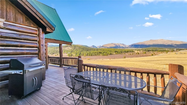 700 Cottage Grove Rd, Alma, CO 80420 - wooden deck with a mountain view, outdoor dining space, a rural view, and a grill