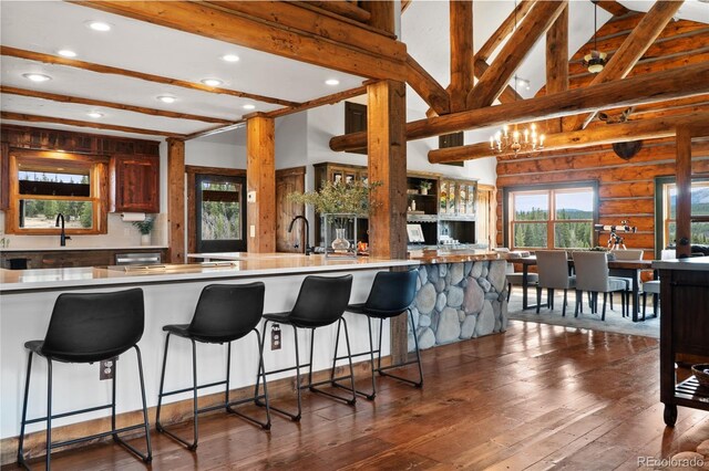 700 Cottage Grove Rd, Alma, CO 80420 - kitchen featuring recessed lighting, open floor plan, a sink, dark wood-style floors, and a breakfast bar