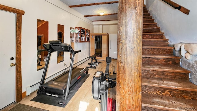 700 Cottage Grove Rd, Alma, CO 80420 - workout room with wood finished floors and a baseboard heating unit