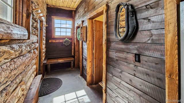 700 Cottage Grove Rd, Alma, CO 80420 - hall featuring unfinished concrete floors and wood walls
