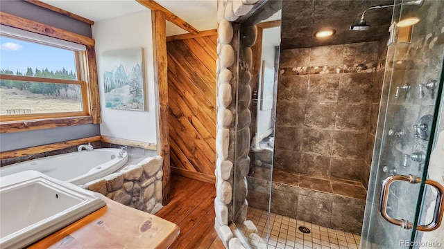 700 Cottage Grove Rd, Alma, CO 80420 - full bath with a shower stall, a bath, wood finished floors, and a sink