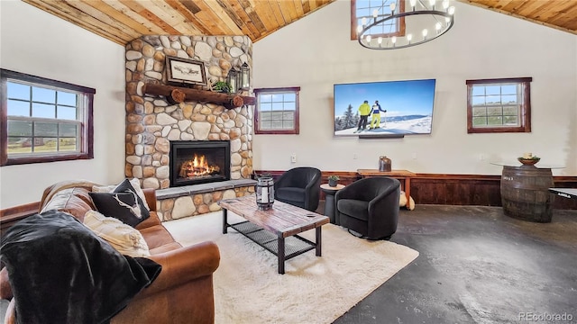 700 Cottage Grove Rd, Alma, CO 80420 - living area featuring wooden ceiling, concrete flooring, a chandelier, a stone fireplace, and high vaulted ceiling