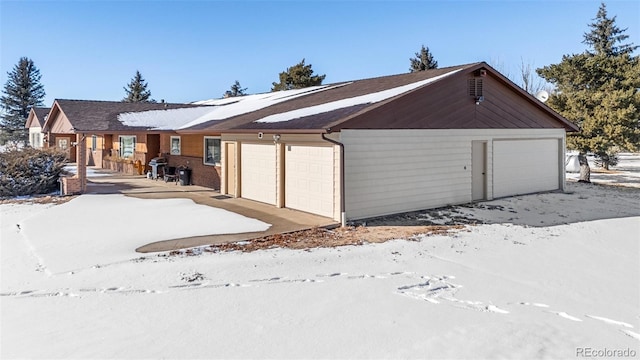 view of snow covered garage