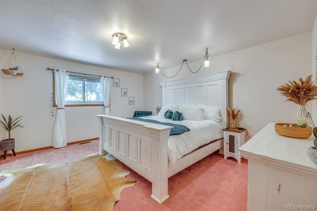 bedroom with light colored carpet