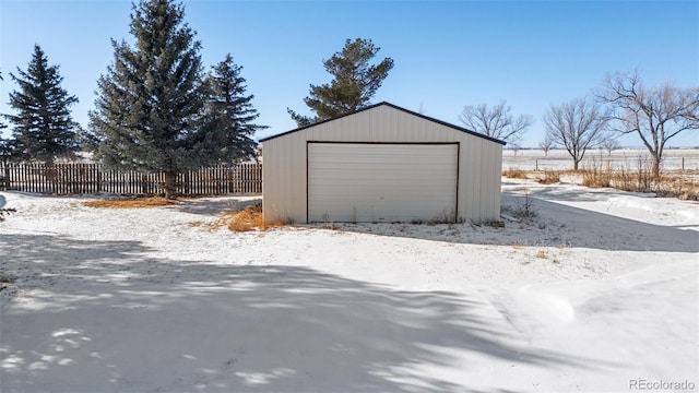 view of snow covered garage