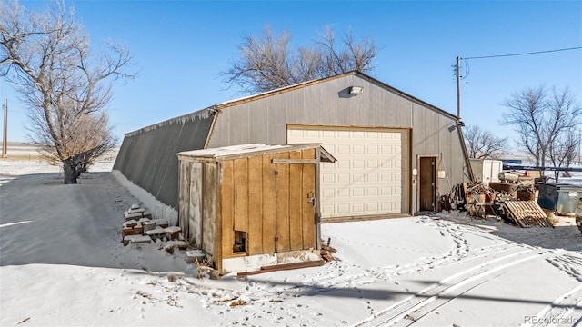 view of snow covered garage