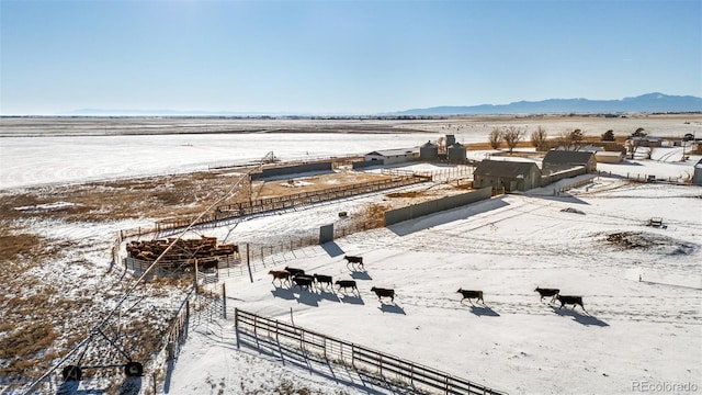 snowy aerial view with a mountain view