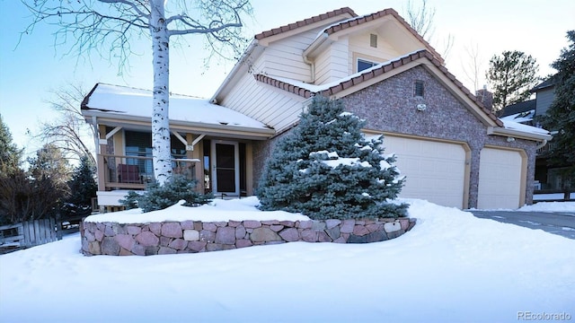 view of front facade with a garage and a porch