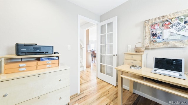 office space featuring hardwood / wood-style floors and french doors