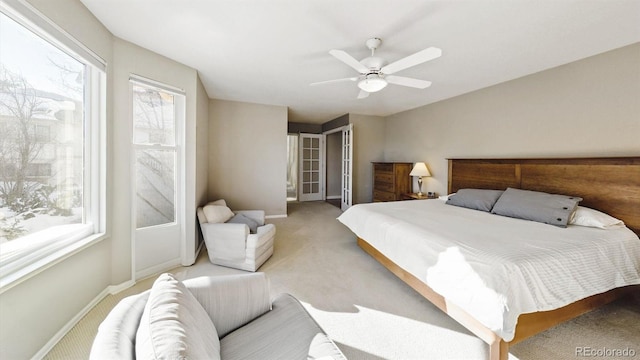 bedroom with light carpet and ceiling fan