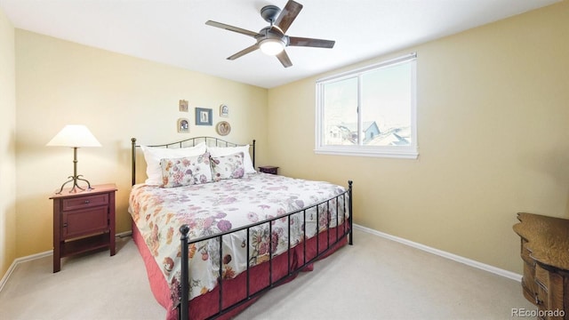 bedroom featuring ceiling fan and light colored carpet