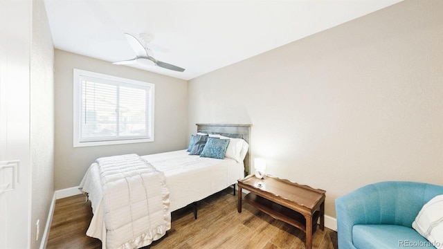 bedroom with hardwood / wood-style flooring and ceiling fan