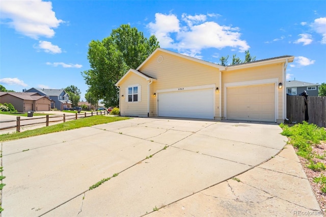 6963 Maram Way, Fountain, CO 80817 - view of front facade featuring an attached garage, concrete driveway, and a residential view