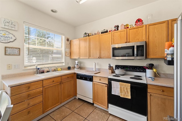 6963 Maram Way, Fountain, CO 80817 - kitchen featuring white appliances, light countertops, and light tile patterned floors