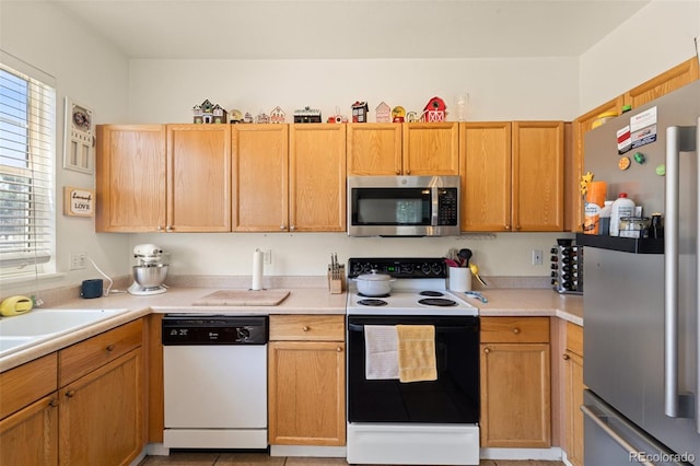 6963 Maram Way, Fountain, CO 80817 - kitchen featuring appliances with stainless steel finishes, plenty of natural light, and light countertops
