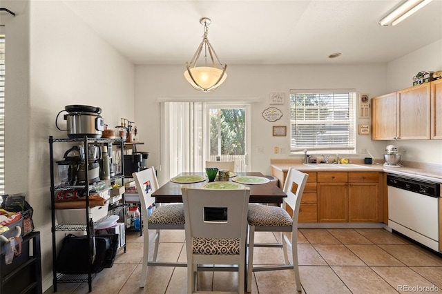 6963 Maram Way, Fountain, CO 80817 - kitchen with white dishwasher, light tile patterned floors, and light countertops