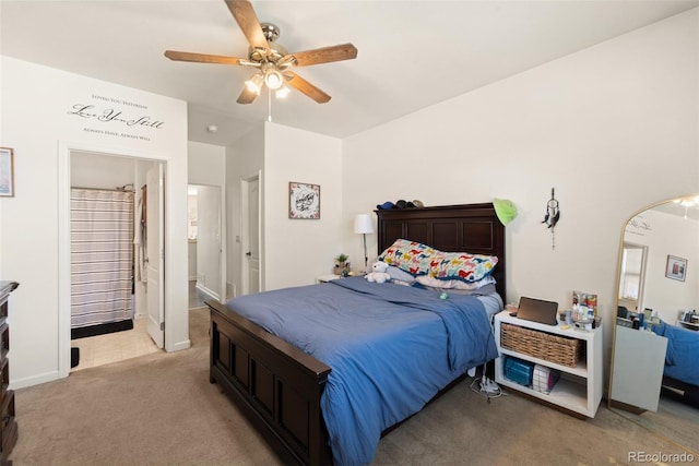 6963 Maram Way, Fountain, CO 80817 - bedroom with light carpet, arched walkways, a ceiling fan, and connected bathroom