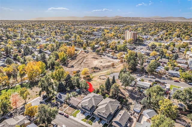 birds eye view of property with a mountain view