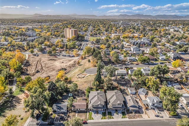 birds eye view of property with a mountain view