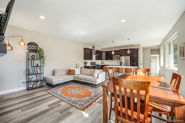 dining room with light hardwood / wood-style flooring