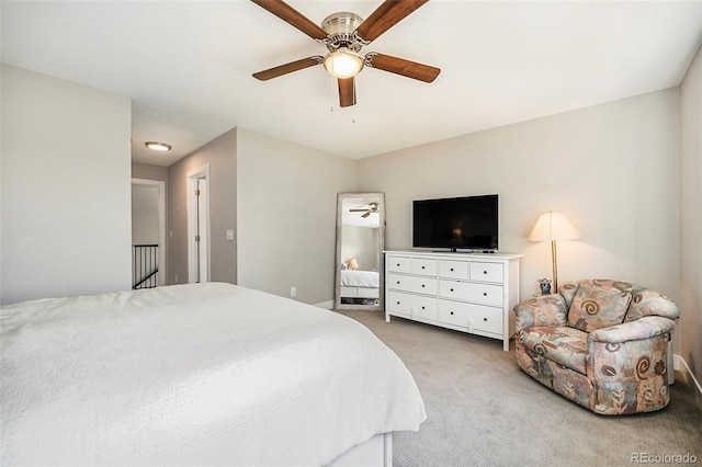 bedroom with ceiling fan and light colored carpet