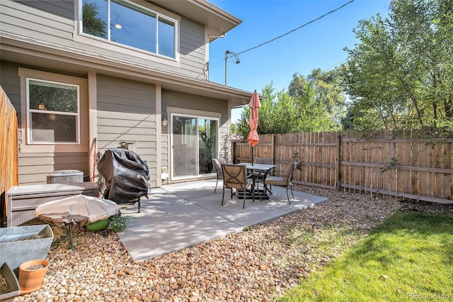 view of patio featuring a grill