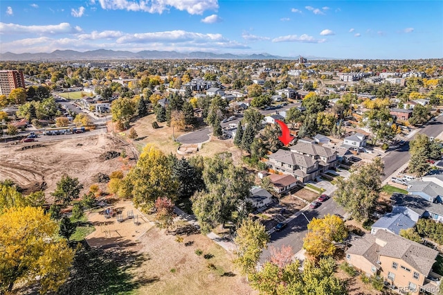 birds eye view of property with a mountain view