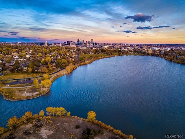 aerial view at dusk with a water view