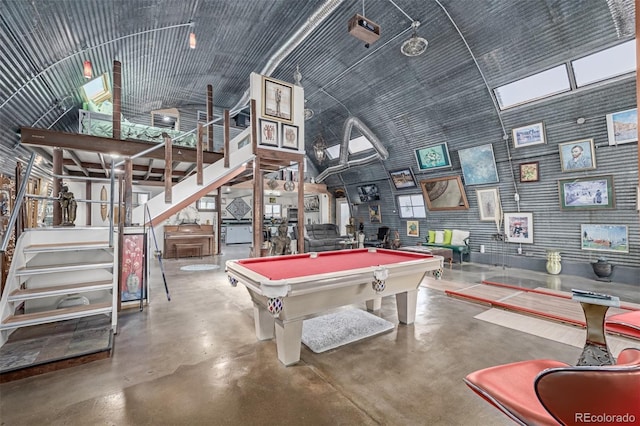 recreation room featuring a high ceiling, finished concrete flooring, and pool table