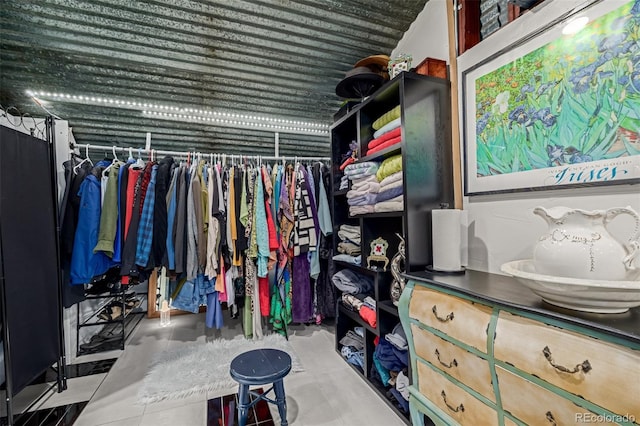 spacious closet featuring tile patterned flooring