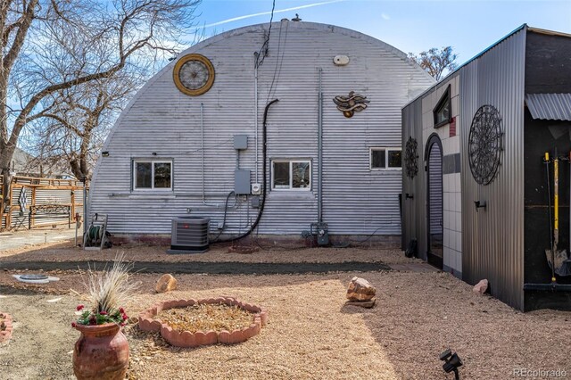 view of side of property featuring central AC unit