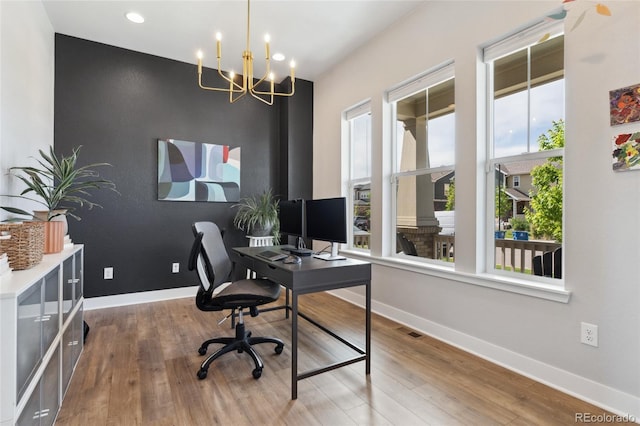 20998 E 60th Pl, Aurora, CO 80019 - office space featuring wood finished floors, a chandelier, and recessed lighting