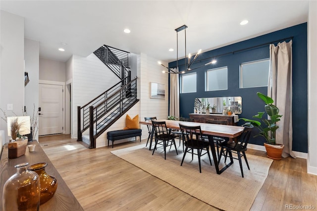 20998 E 60th Pl, Aurora, CO 80019 - dining room with stairs, light wood-style floors, a chandelier, and recessed lighting