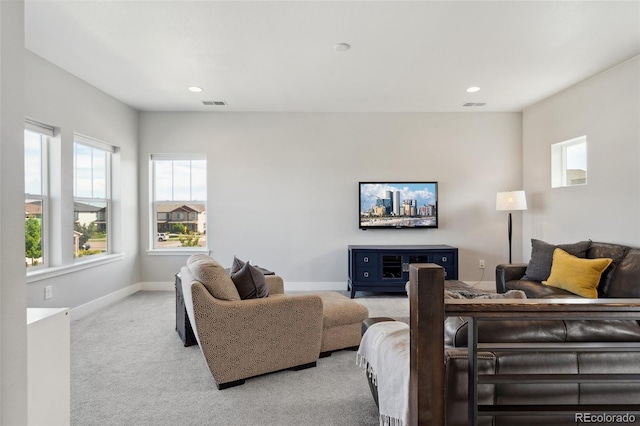 20998 E 60th Pl, Aurora, CO 80019 - living room featuring plenty of natural light, light colored carpet, and recessed lighting