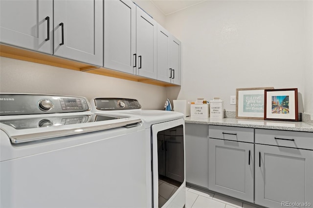 20998 E 60th Pl, Aurora, CO 80019 - laundry area with separate washer and dryer, cabinet space, and light tile patterned flooring