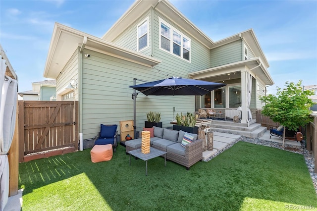 20998 E 60th Pl, Aurora, CO 80019 - back of property with an outdoor living space, a patio area, and a gate