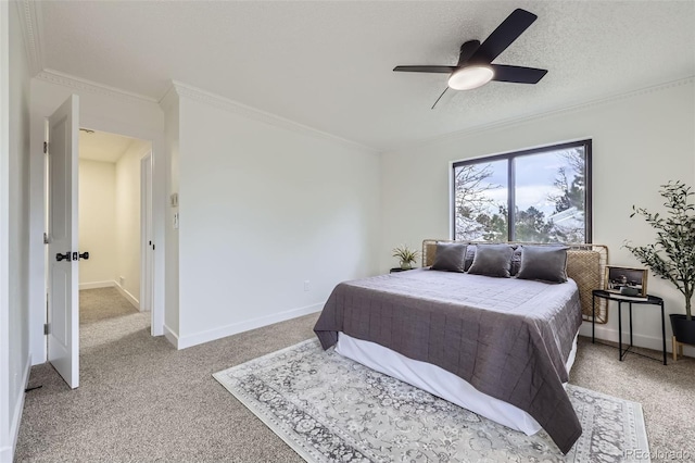 bedroom with light colored carpet, baseboards, a textured ceiling, and ornamental molding