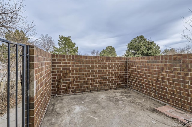 view of patio featuring fence