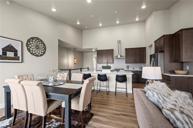 8244 S Queen St, Littleton, CO 80127 - dining space featuring a towering ceiling, light wood-type flooring, and recessed lighting