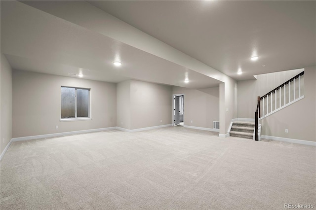 8244 S Queen St, Littleton, CO 80127 - finished basement featuring stairs, light carpet, baseboards, and recessed lighting