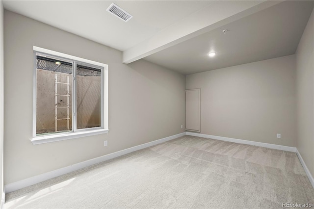 8244 S Queen St, Littleton, CO 80127 - unfurnished room featuring carpet floors, baseboards, plenty of natural light, and beamed ceiling
