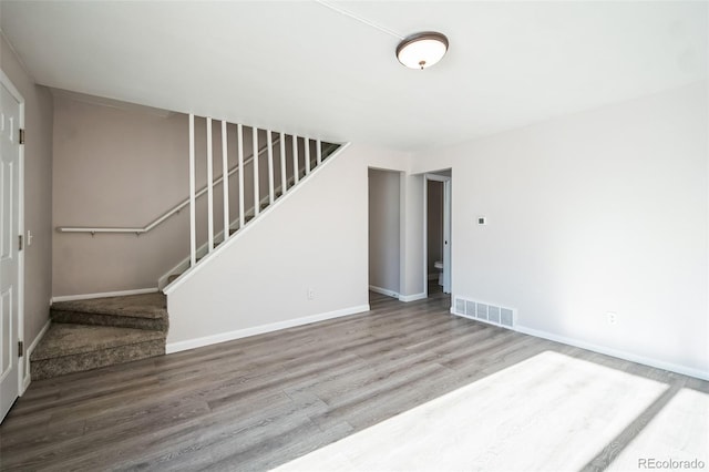 unfurnished room featuring hardwood / wood-style floors