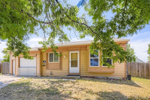 1961 Danube Way, Aurora, CO 80011 - ranch-style house featuring an attached garage and concrete driveway
