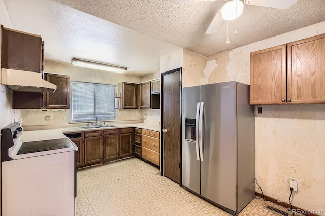 1961 Danube Way, Aurora, CO 80011 - kitchen with stainless steel refrigerator with ice dispenser, electric stove, light floors, a textured ceiling, and a ceiling fan