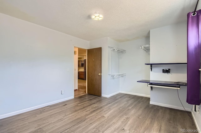 1961 Danube Way, Aurora, CO 80011 - walk in closet featuring wood finished floors