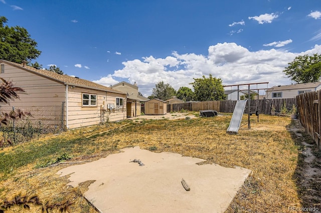 1961 Danube Way, Aurora, CO 80011 - fenced backyard with a storage unit