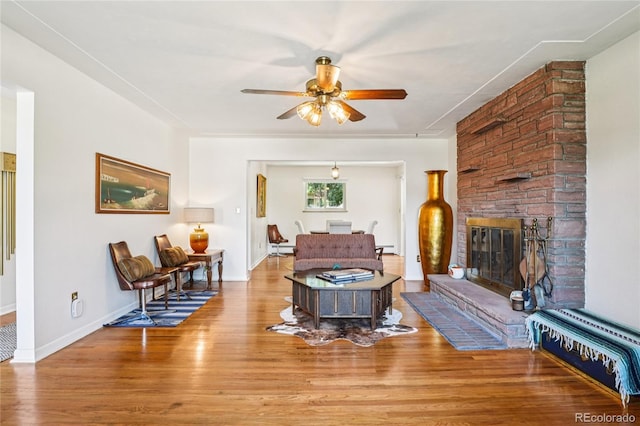 6920 W 47th Pl, Wheat Ridge, CO 80033 - living area featuring ceiling fan, wood finished floors, and a large fireplace