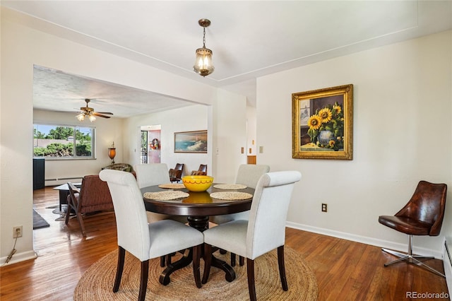 6920 W 47th Pl, Wheat Ridge, CO 80033 - dining room featuring wood finished floors and baseboard heating