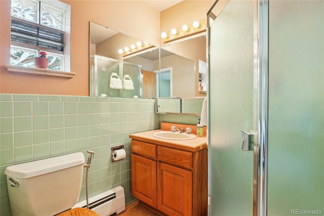6920 W 47th Pl, Wheat Ridge, CO 80033 - bathroom featuring tile walls, a baseboard radiator, a stall shower, and vanity